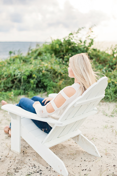 Girl on adirondack chair looking out over ocean on Sullivan's Island by Kaitlin Scott Photography