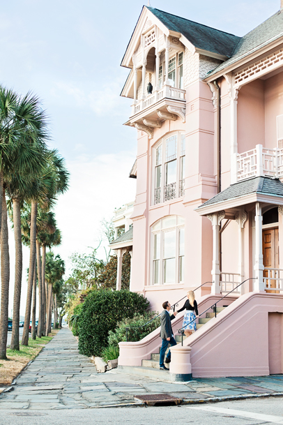 Couple at pink home on Charleston battery by SC Wedding Photographer
