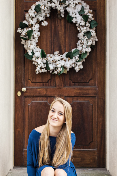 High School Pictures by wooden door with cotton wreath