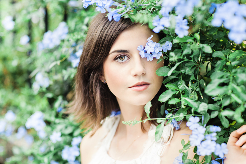 Portrait of a girl in flowers and greenery by Charleston photographer Kaitlin Scott