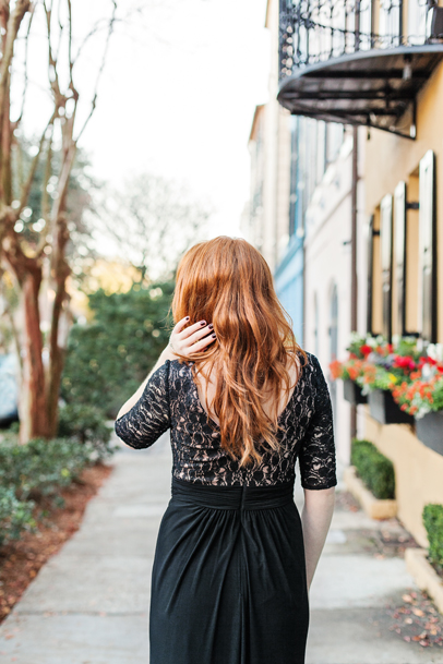 Redhead in black lace dress at Rainbow Row in Charleston, SC by Kaitlin Scott Photography