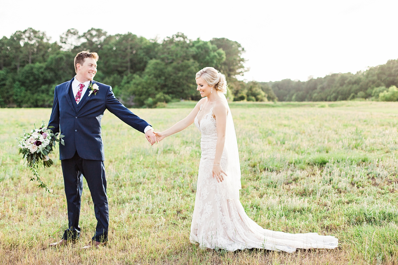 Bride and Groom in a field at Sunset | Kaitlin Scott Photography