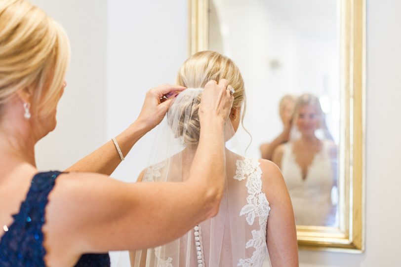 Mother of Bride putting on Daughter's Veil by Kaitlin Scott Photography