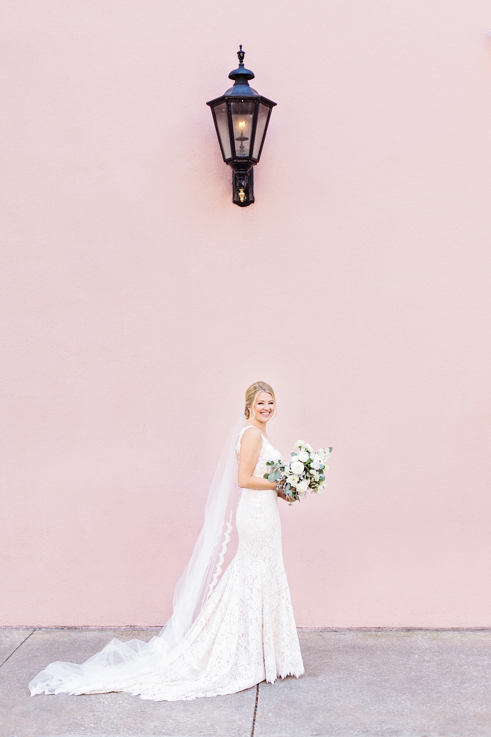 Excited Bride by Charleston Pink Building before her First Look by Kaitlin Scott Photography