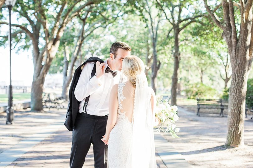 Bride and Groom kissing in Charleston's Waterfront Park by Kaitlin Scott Photography