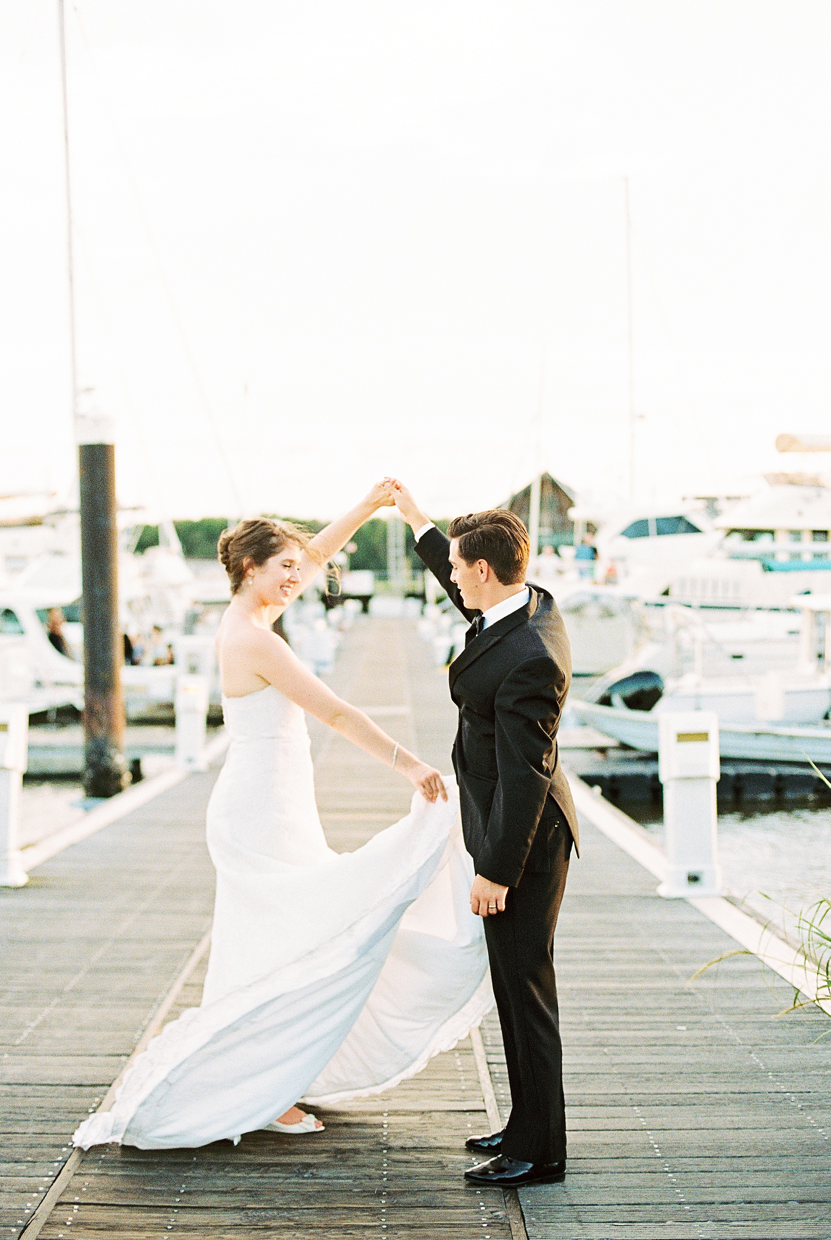 Bride and Groom dance by boats at Charleston Marina | Kaitlin Scott Photography