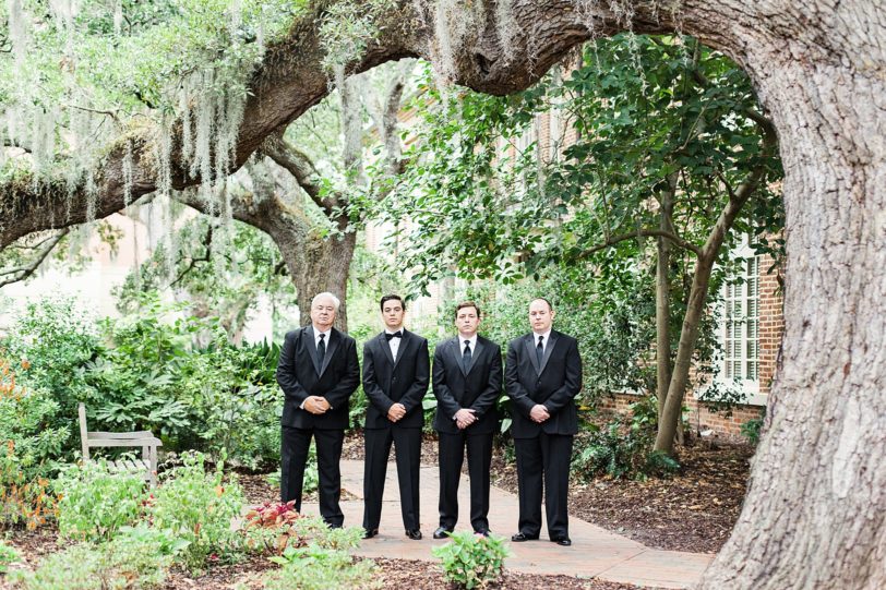 Charleston Groom and Groomsmen under oaks and Spanish moss at St. Luke's Chapel | Kaitlin Scott Photography