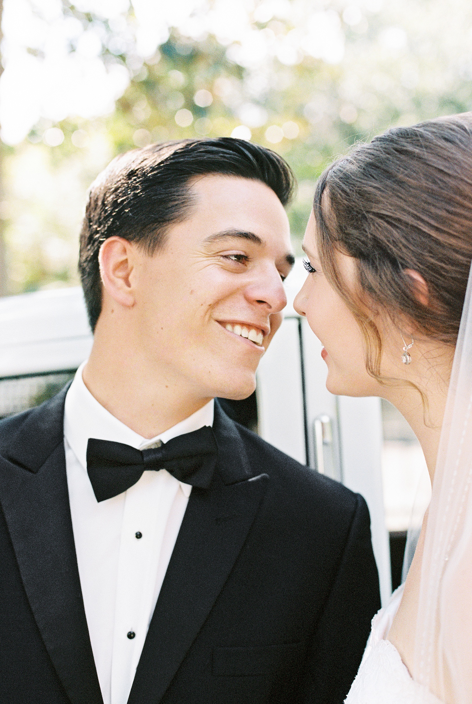 Film Portrait of Groom Smiling at Bride on Wedding Day | Kaitlin Scott Photography