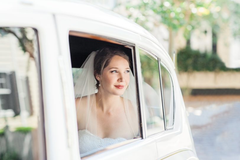 Charleston Bride Looking out of White Limo | Kaitlin Scott Photography