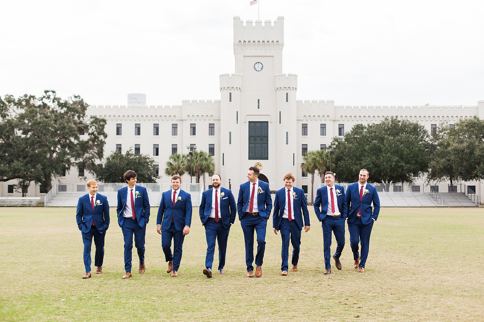 Winter Wedding, Groomsmen in blue suits and burgundy ties at Charleston Citadel | Kaitlin Scott Photography