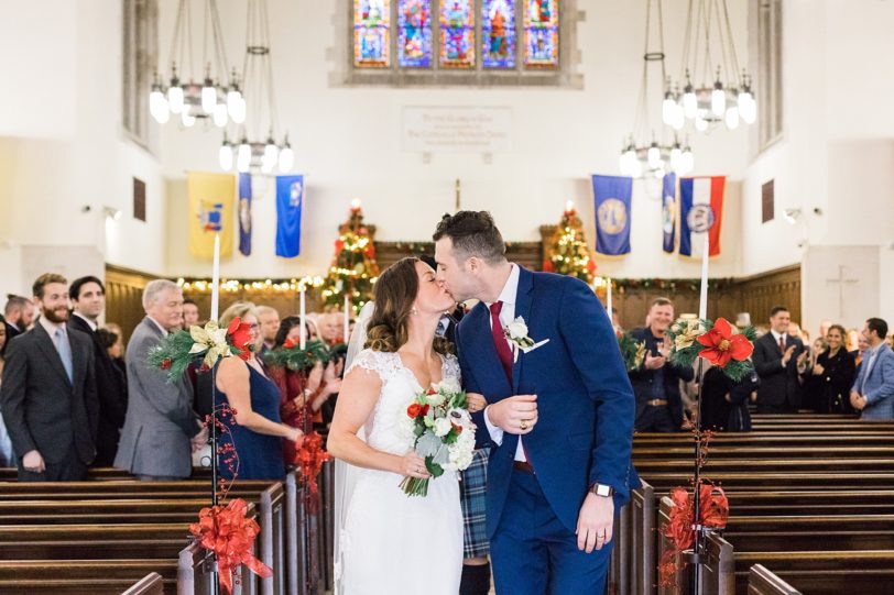 Charleston Bride and Groom kissing in aisle | Kaitlin Scott Photography