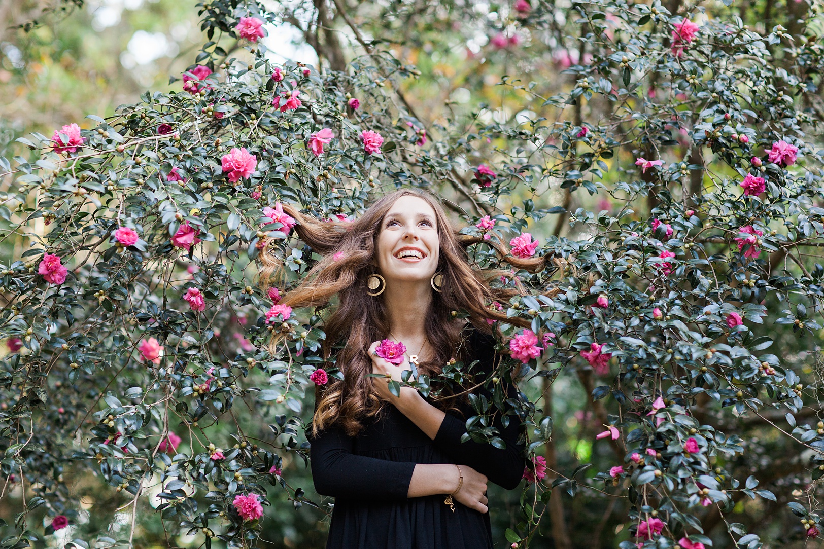 Girl with hair in camellia tree at Charles Towne Landing | Kaitlin Scott Photography