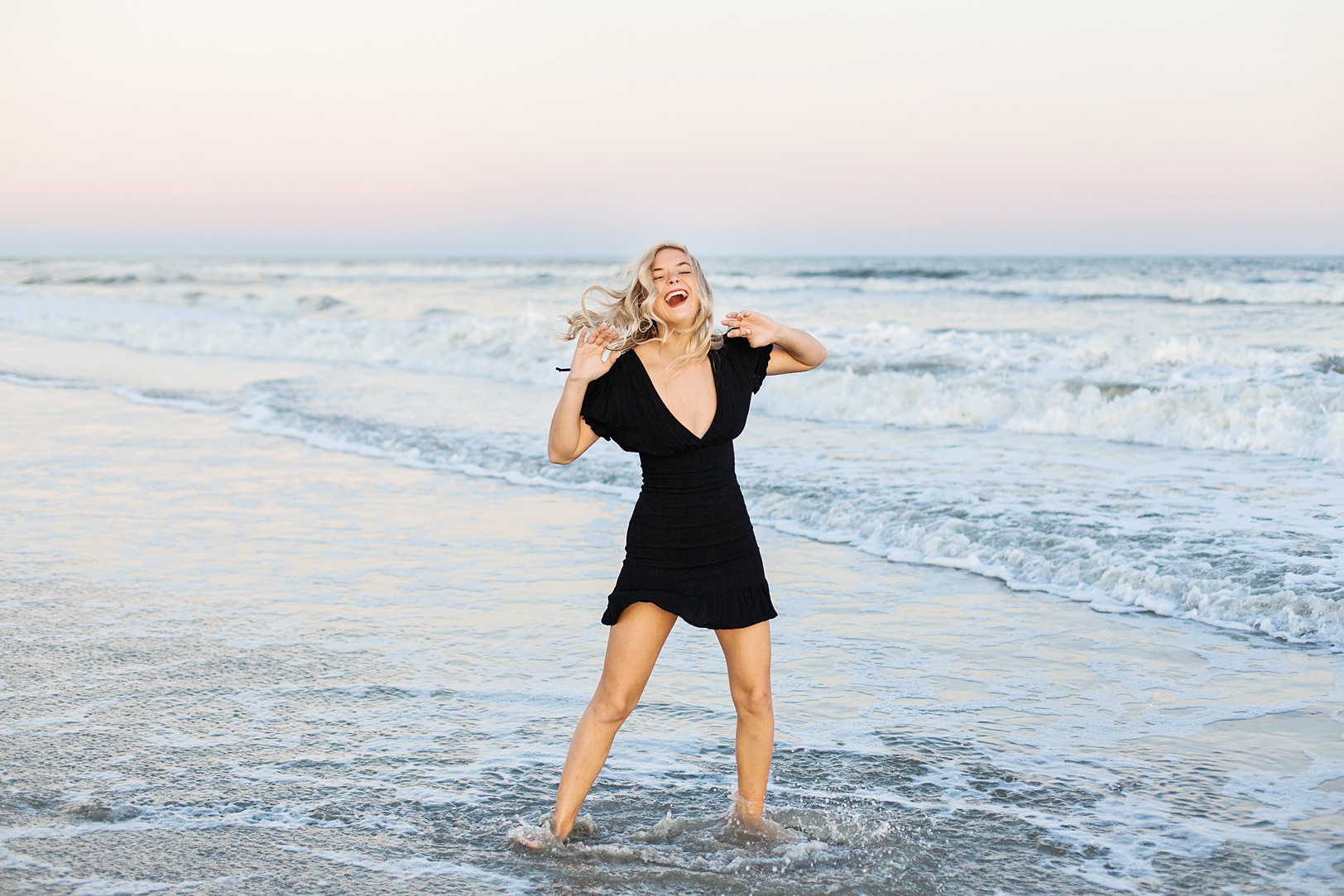 Laughing Senior Girl at Folly Beach at sunset | Kaitlin Scott Photography