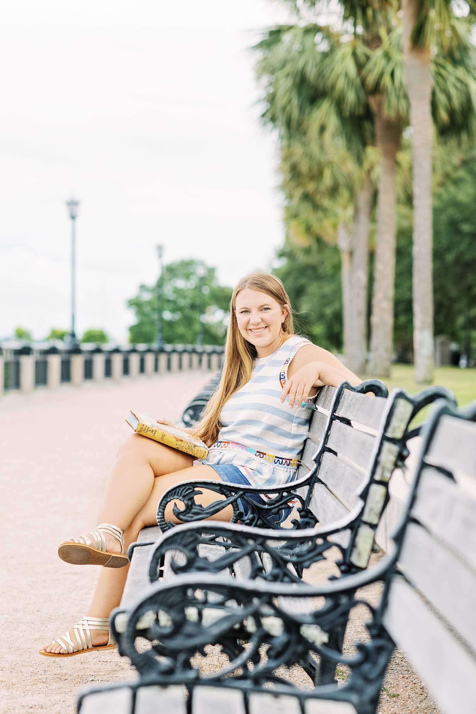 Girl reading book on bench at Waterfront Park | SC High School Photographer Kaitlin Scott