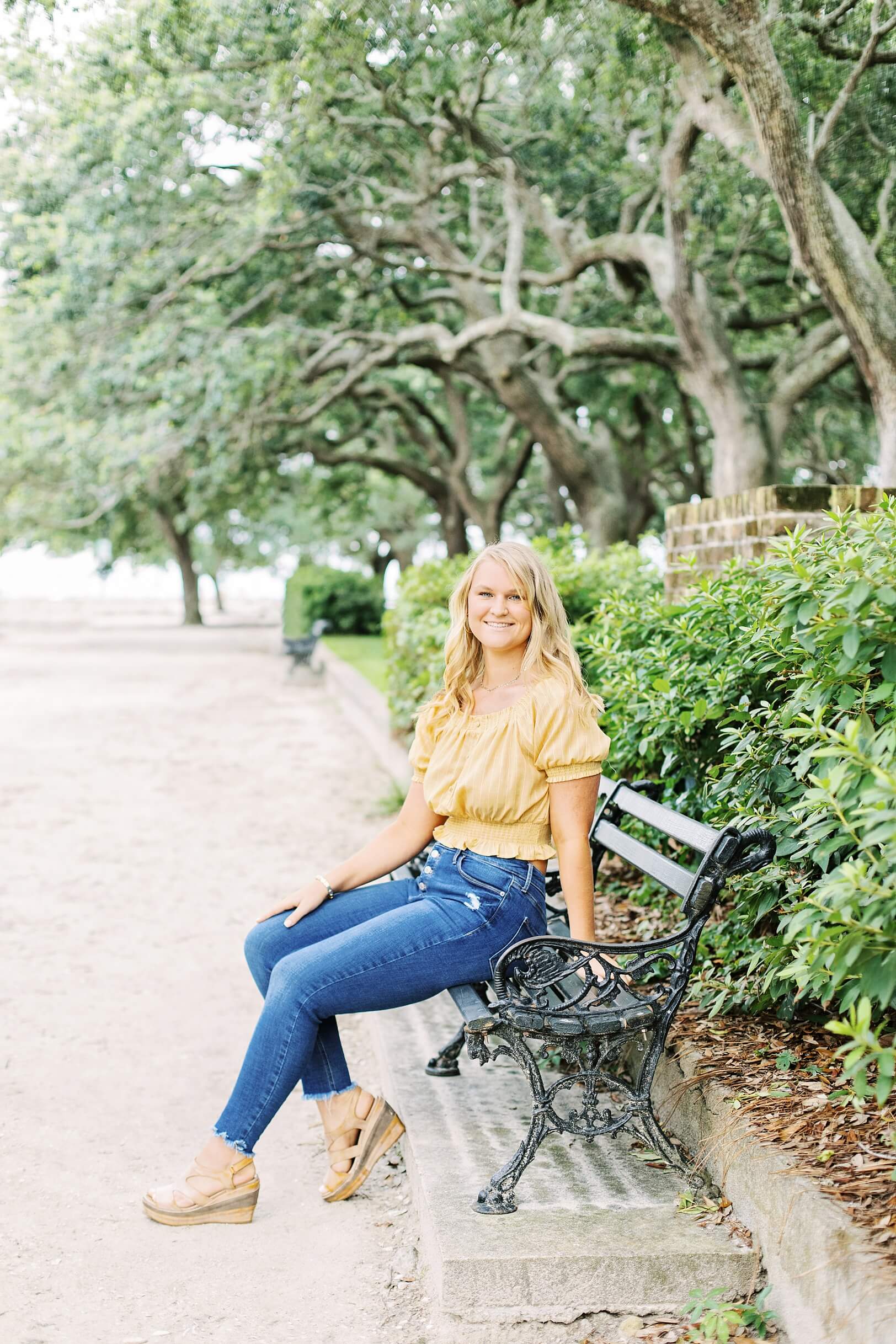 Senior girl on bench at White Point Gardens | Charleston photographer Kaitlin Scott