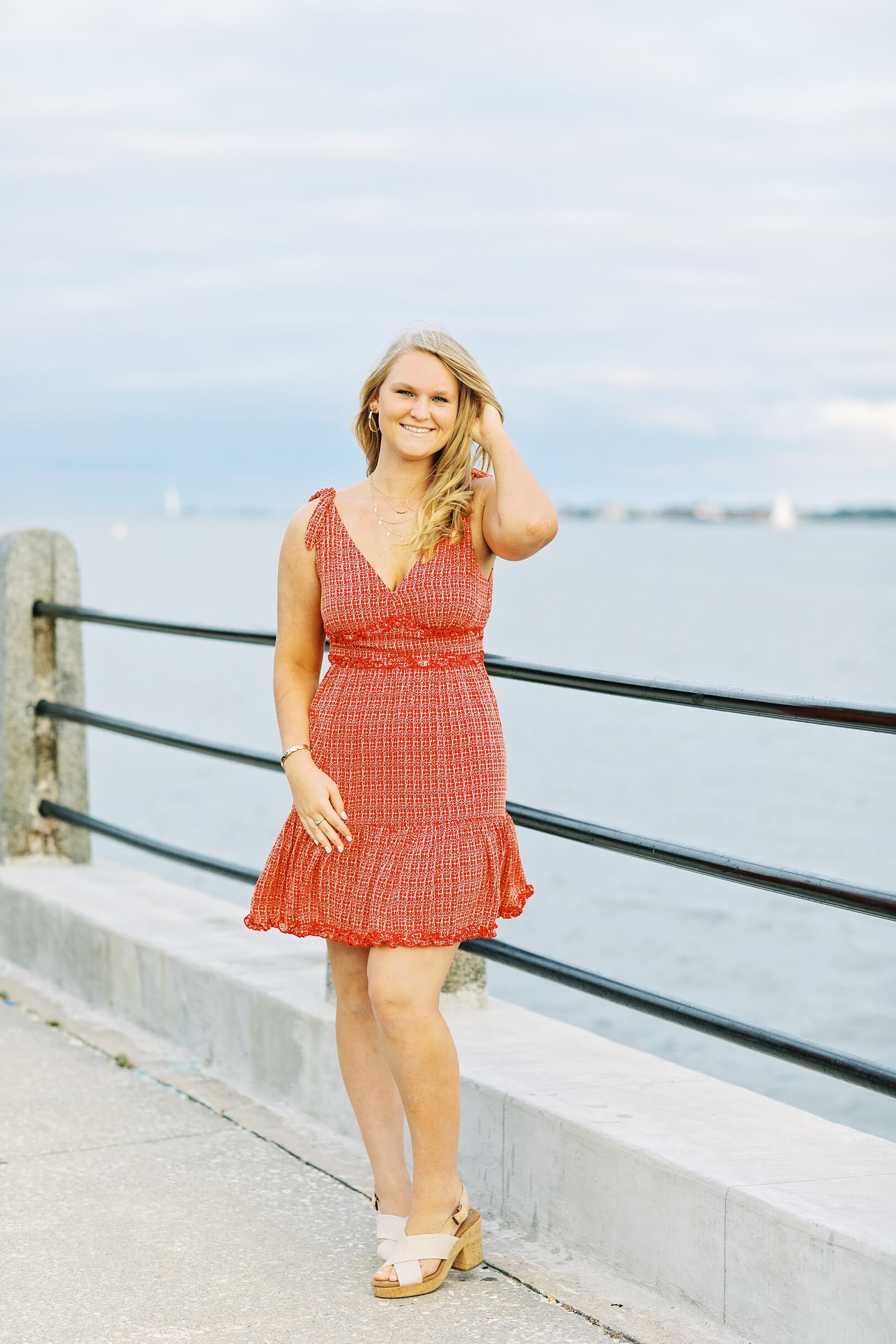 Girl in red dress at sunset in Charleston | Kaitlin Scott Photography