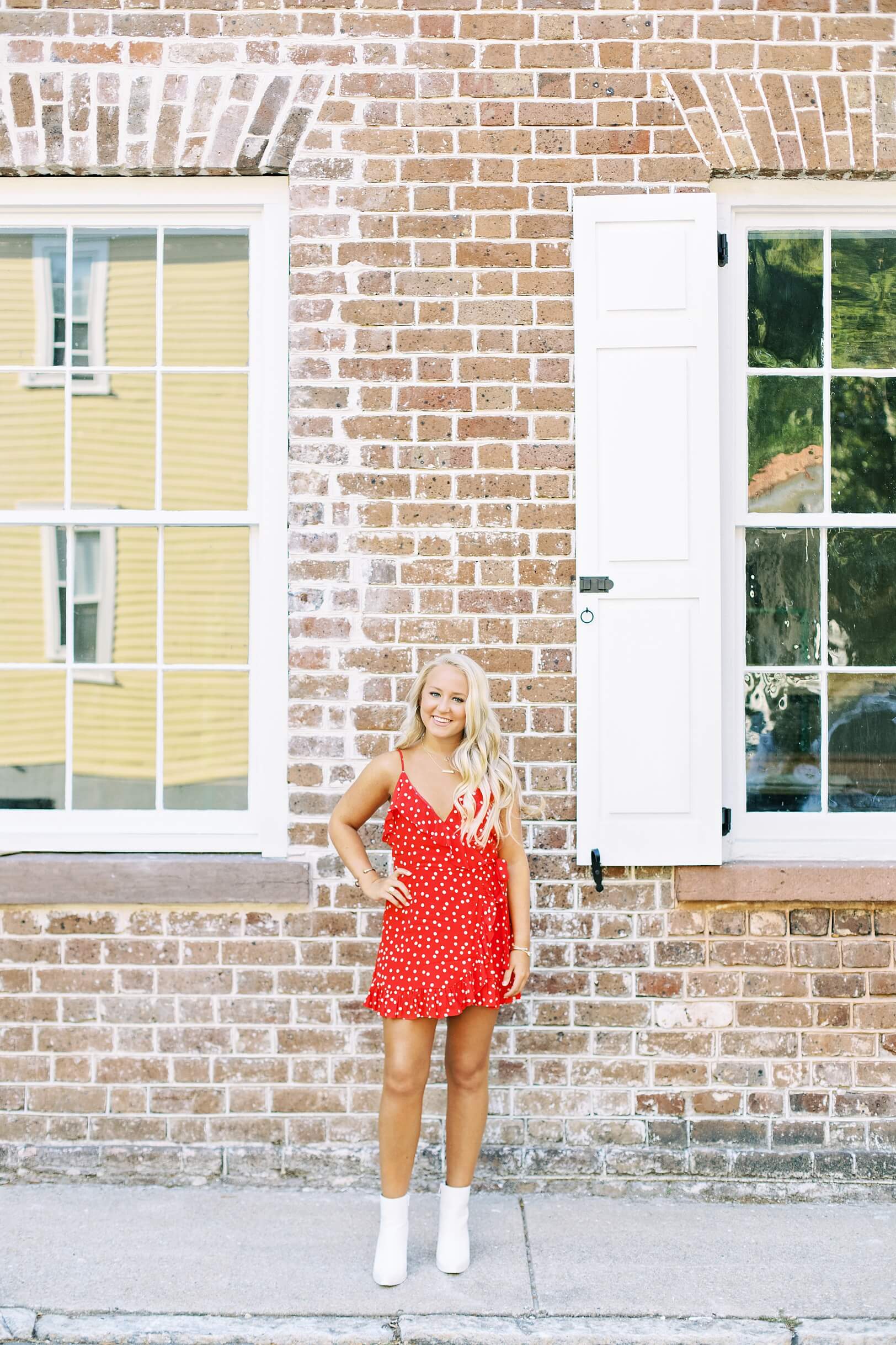 Charleston architecture, girl in red dress by brick wall | Kaitlin Scott Photography
