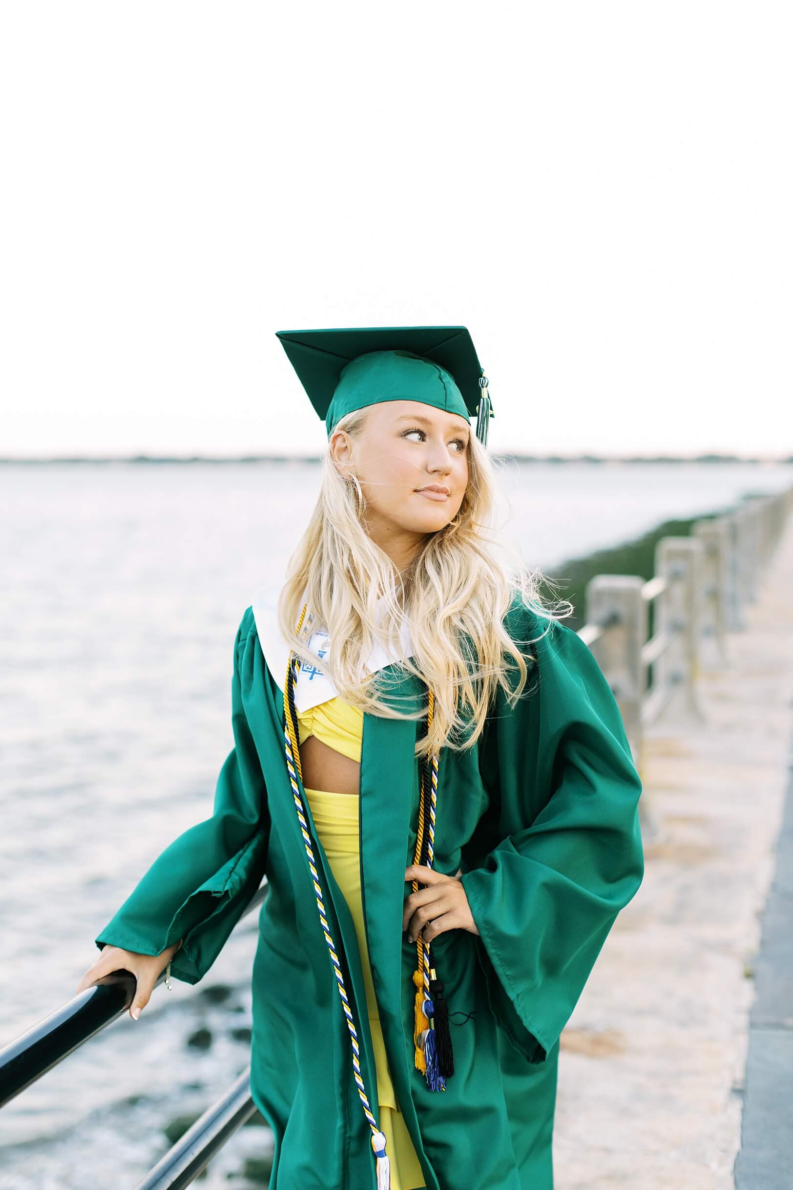 Emerald cap and gown for senior pictures on Charleston Battery
