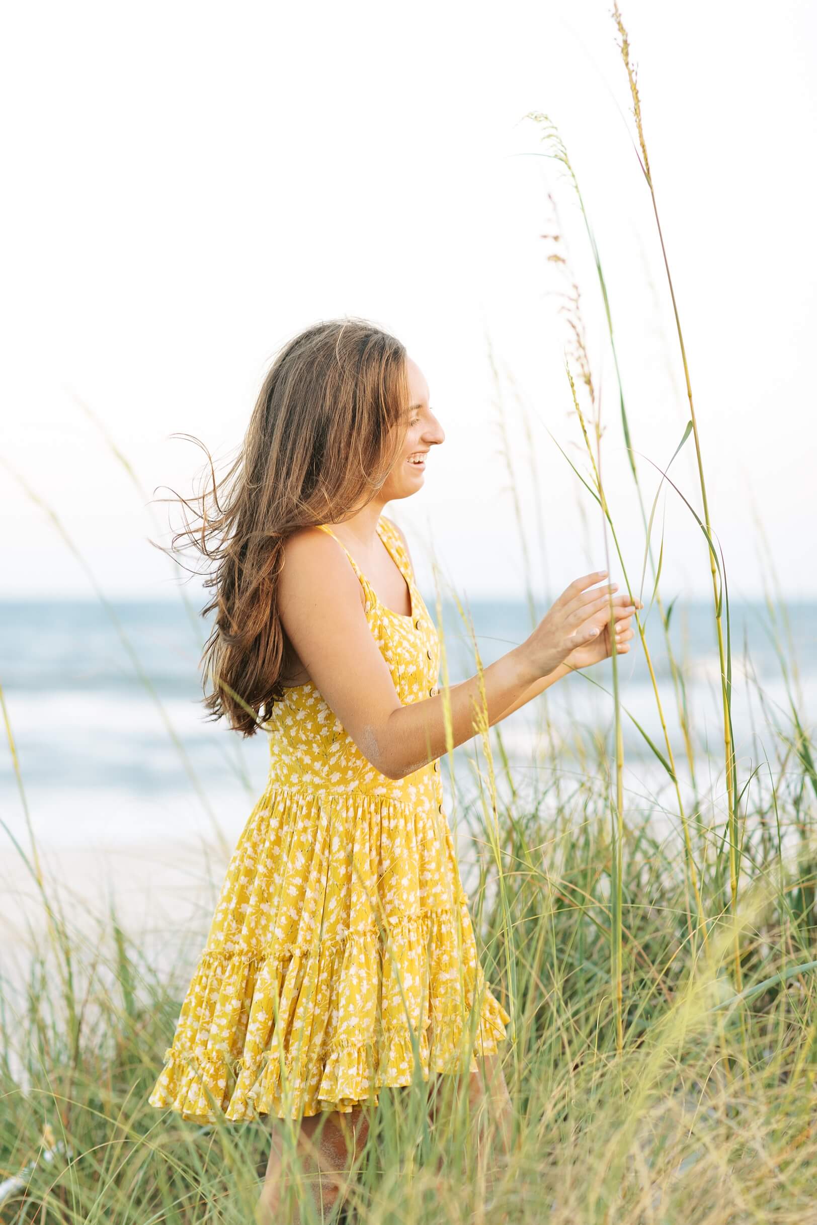 Girl in yellow dress at Folly beach 