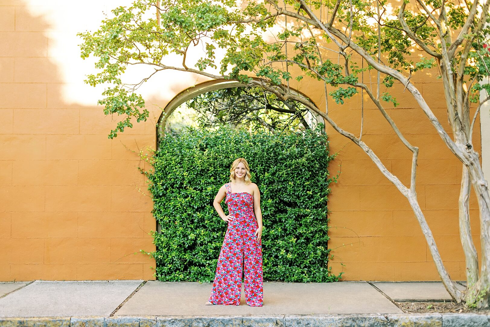 70s inspired Senior Session, Colorful orange walls and green ivy Senior Pictures in Charleston