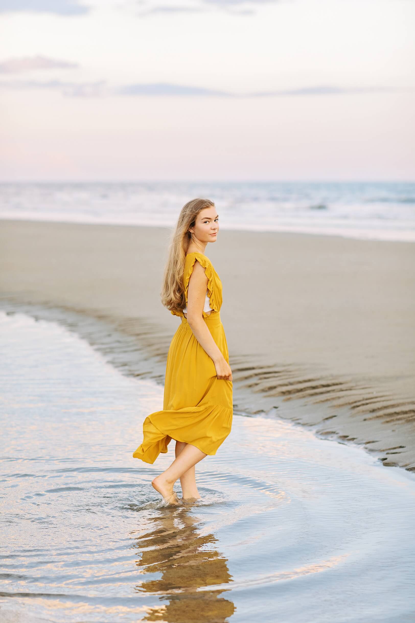 Girl walking in ocean, Pastel Sunset | Charleston Senior Photographer