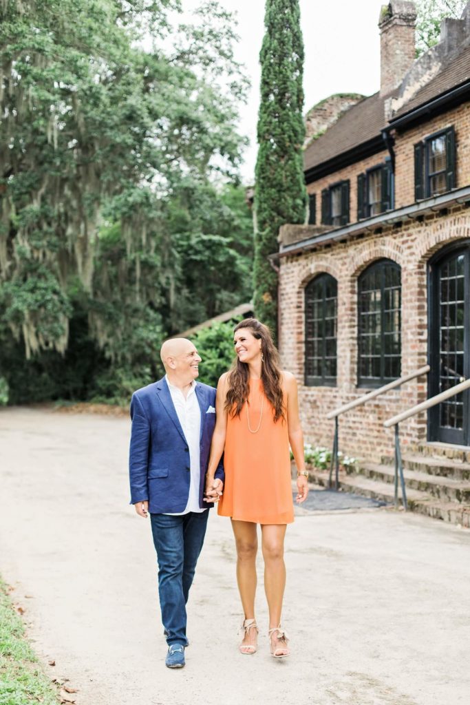Laughing couple holding hands at Middleton Place | Kaitlin Scott Photography