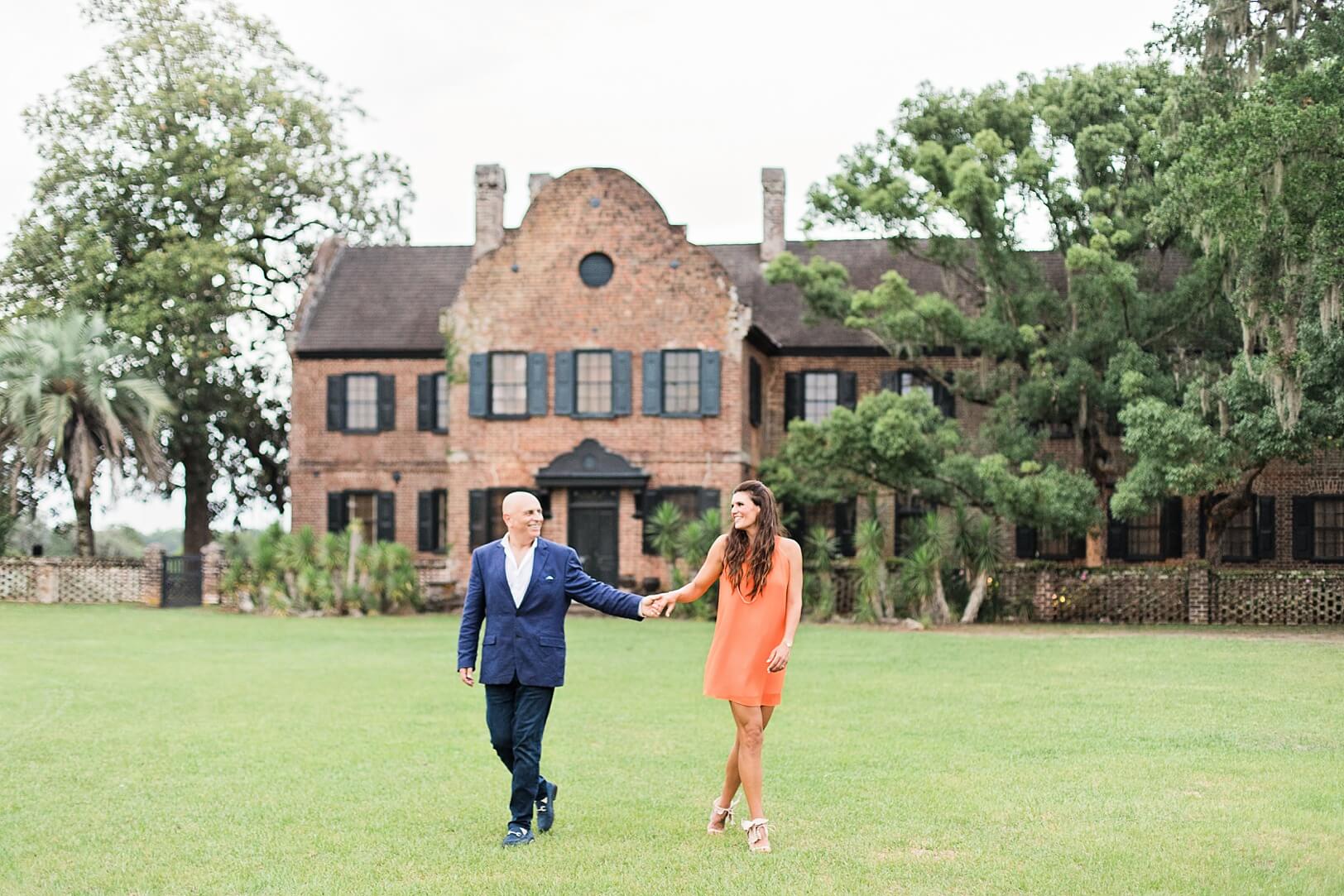 Couple holding hands at historic Charleston plantation
