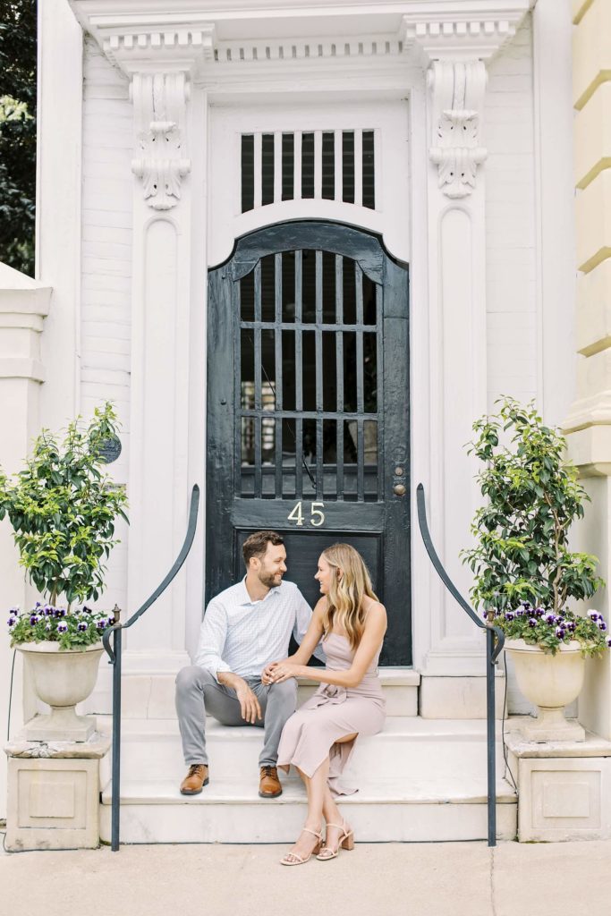 Couple sitting on porch step of Charleston single home | Kaitlin Scott Photography