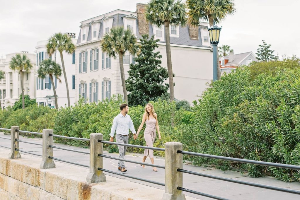 Engagement shoot on Charleston Battery, couple holding hands by Kaitlin Scott Photography