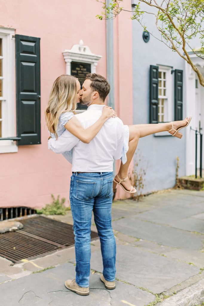 Man carrying his fiance in his arms | Engagement shoot in Charleston