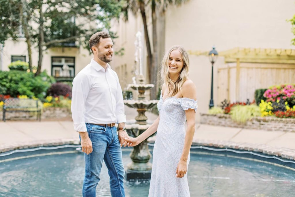 Couple by fountain in Charleston, SC